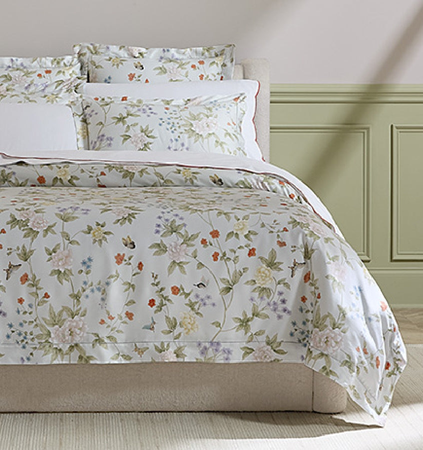 SFERRA bedding on a made bed in a bedroom