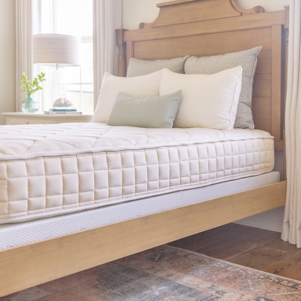 Naturepedic Chorus Latex-Free Organic Mattress on a bed in a bedroom