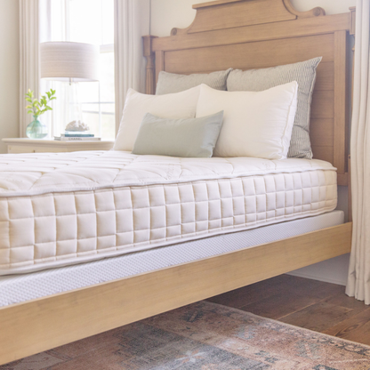 Naturepedic Chorus Latex-Free Organic Mattress on a bed in a bedroom