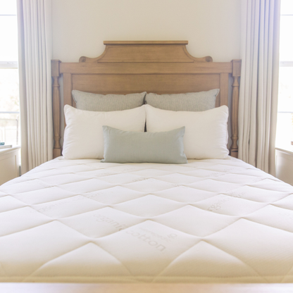Naturepedic Chorus Latex-Free Organic Mattress on a bed, front view
