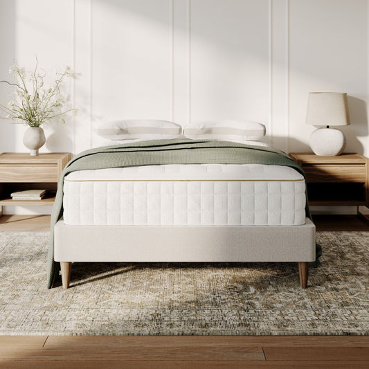 Naturepedic EOS Classic Organic Mattress on a bed in a bedroom