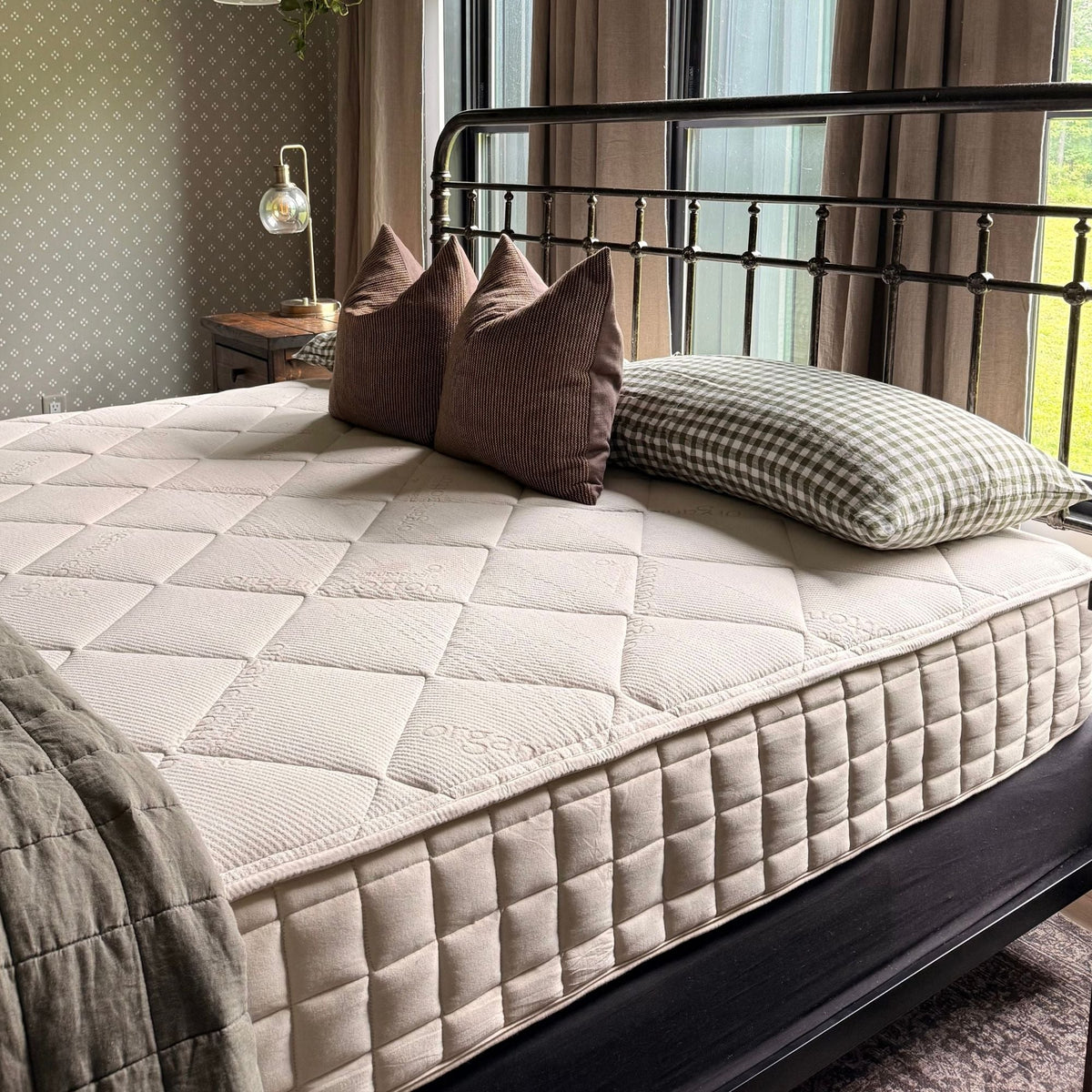 Naturepedic Serenade Organic Hybrid Mattress - Plush on a bed in a bedroom