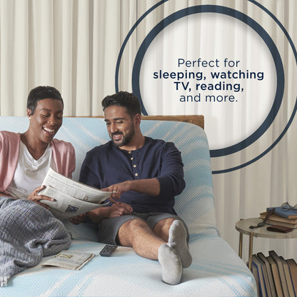 Smiling couple reading and relaxing on a TEMPUR-Ergo adjustable base with head elevated, highlighting comfort for watching TV, sleeping, and reading