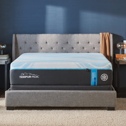 Luxurious TEMPUR-LuxeBreeze Soft mattress displayed in a modern bedroom with tufted headboard and ambient lighting.
