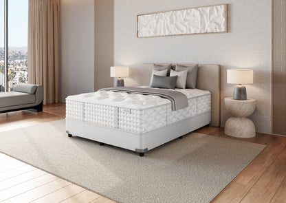 Colchón Aireloom Preferred Timeless Odyssey Streamline Luxury Firm en un dormitorio, vista lateral