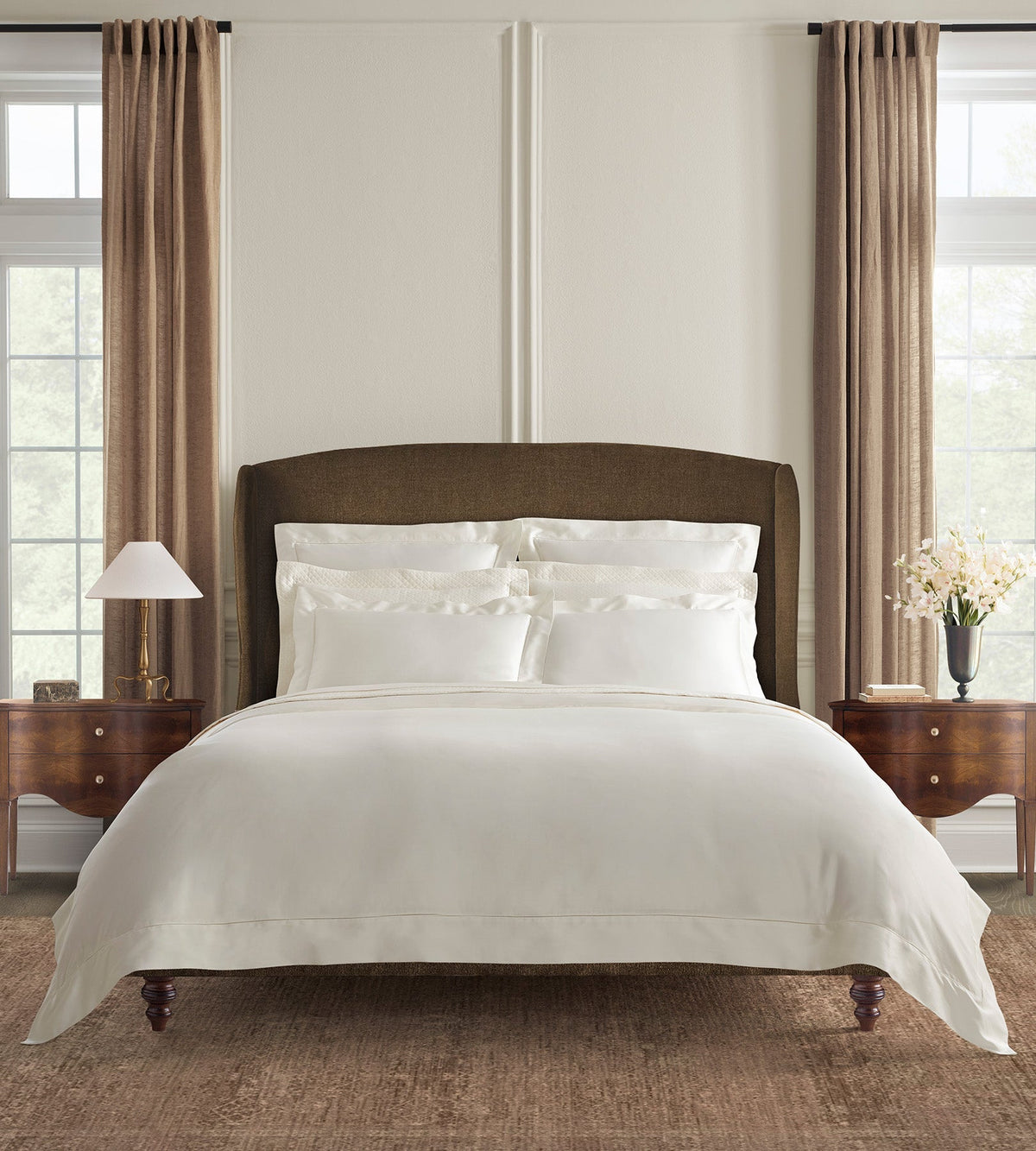 SFERRA bedding on a made bed in a bedroom