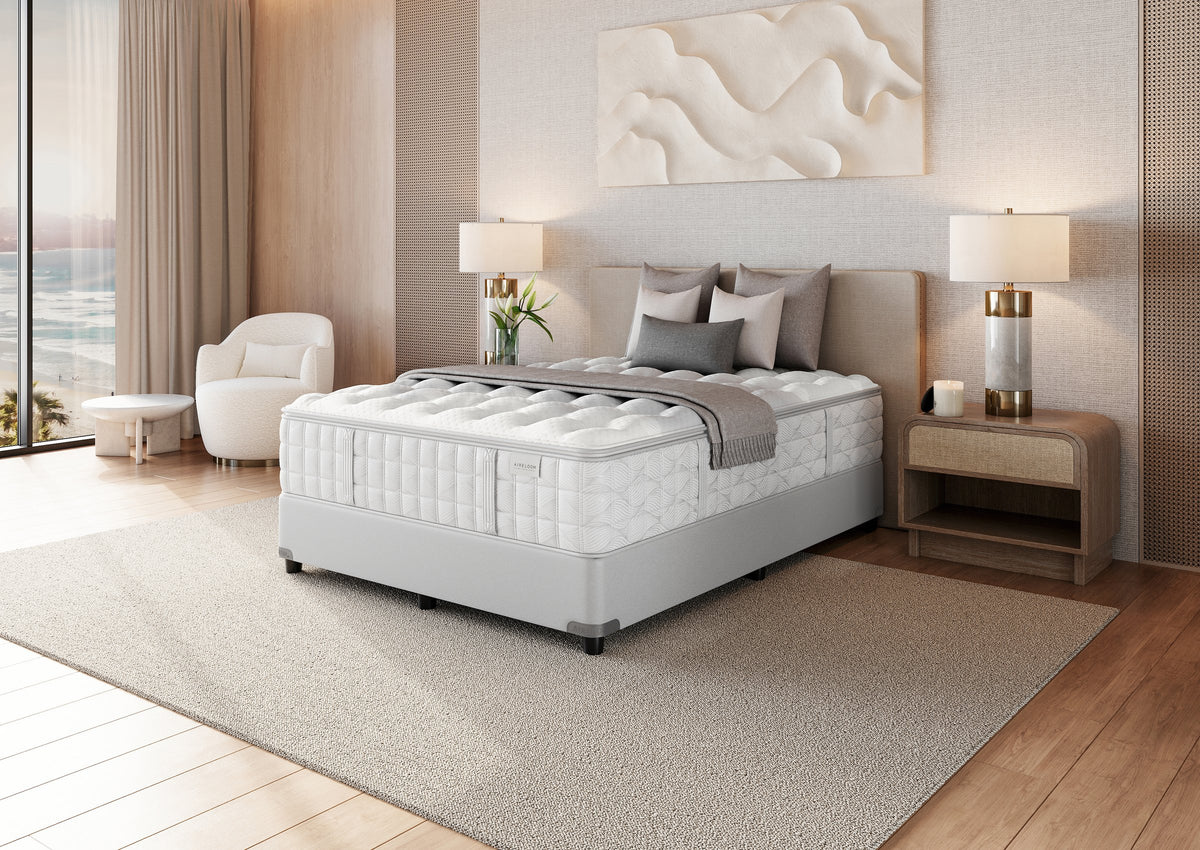 Aireloom Preferred Timeless Odyssey Luxetop M1 Firm mattress in a bedroom, side view