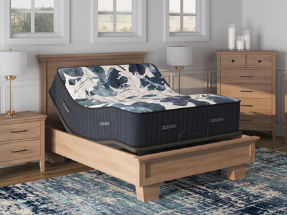 Sherwood Bedding Luxuria Firm Tight Top mattress, on an adjustable base in a styled bedroom