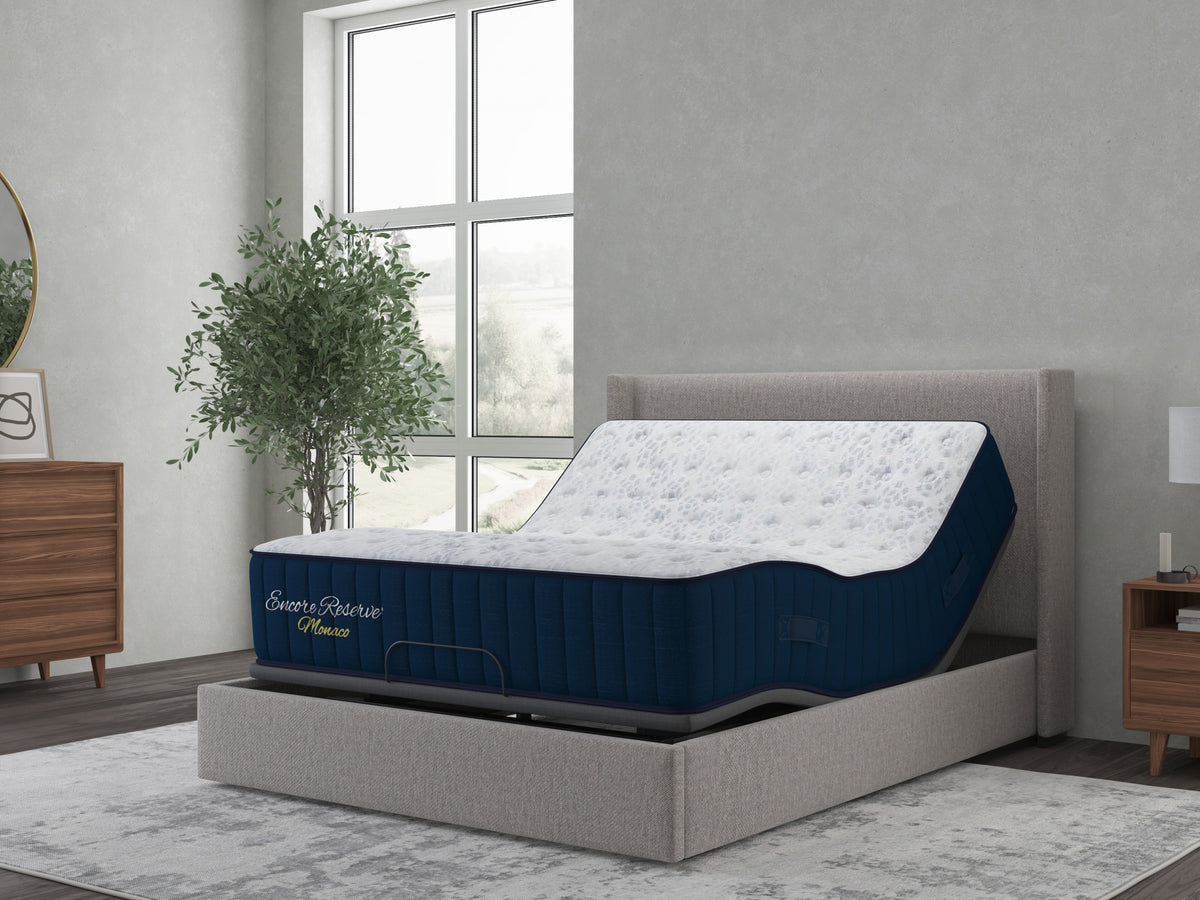 Sherwood Bedding Monaco 2.0 Firm Tight Top mattress, on an adjustable base in a styled bedroom