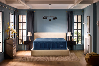 Stearns & Foster Estate Medium Hybrid II mattress in a styled bedroom, front view