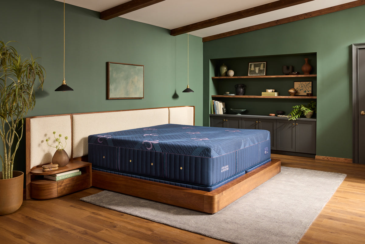 Stearns & Foster Legacy Medium Hybrid II mattress in a styled bedroom, three-quarter view