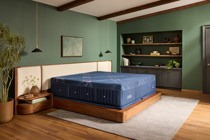 Stearns & Foster Legacy Medium Hybrid II mattress in a styled bedroom, three-quarter view