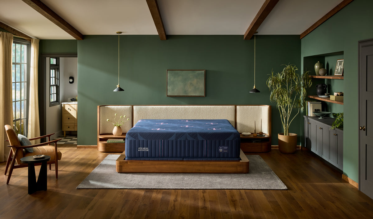 Stearns & Foster Legacy Medium Hybrid II mattress in a styled bedroom, front view
