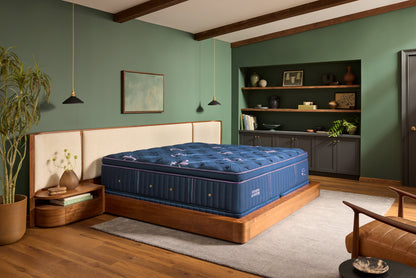 Stearns & Foster Legacy Medium Pillow Top II mattress in a styled bedroom, three-quarter view