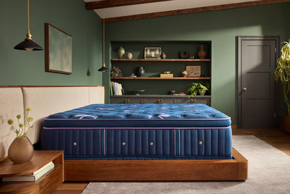 Stearns & Foster Legacy Medium Pillow Top II mattress in a styled bedroom, side view