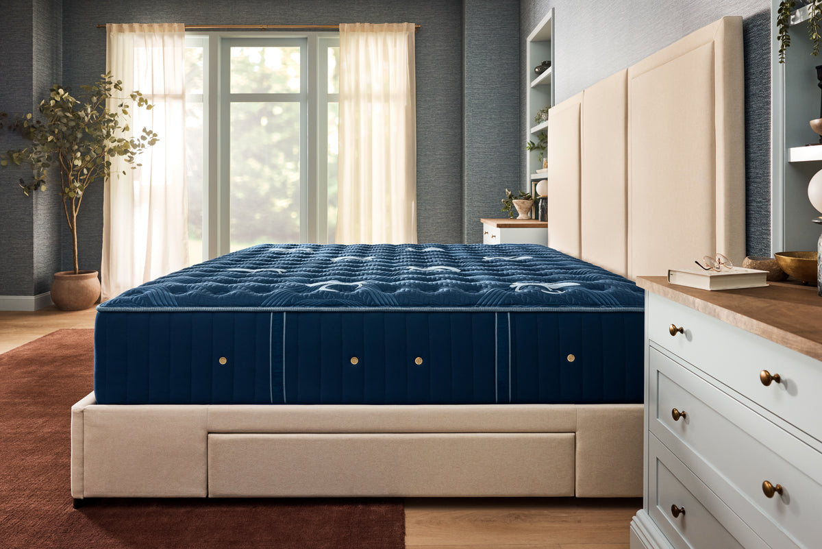 Stearns & Foster Lux Estate Firm Tight Top II mattress in a styled bedroom, side view