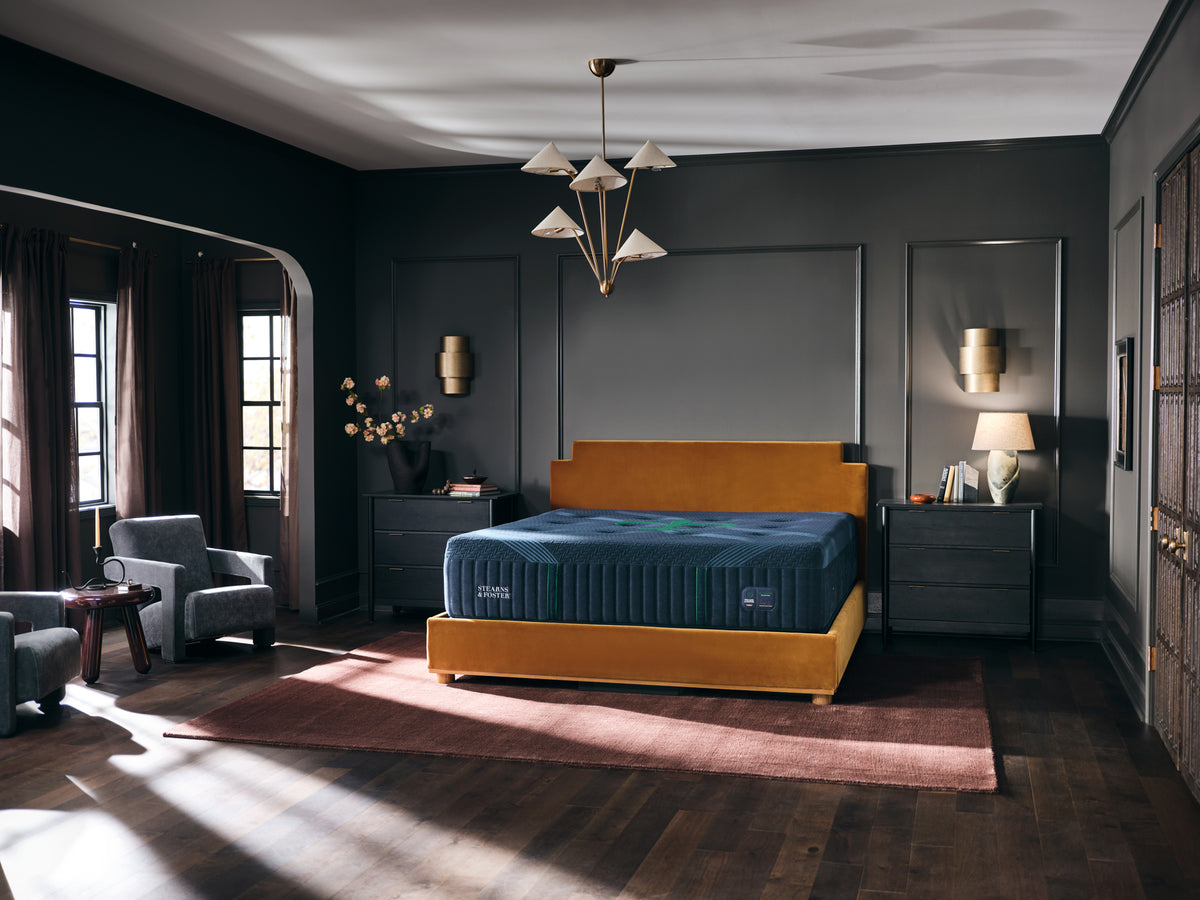 Stearns & Foster Reserve Medium Hybrid II mattress in a styled bedroom, three-quarter view
