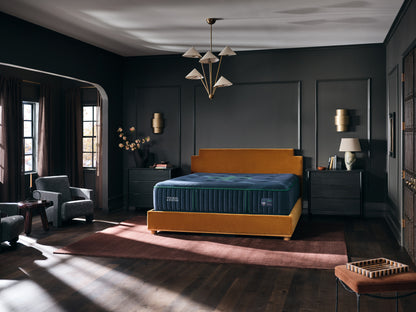 Stearns & Foster Reserve Medium Tight Top II mattress in a styled bedroom, three-quarter view