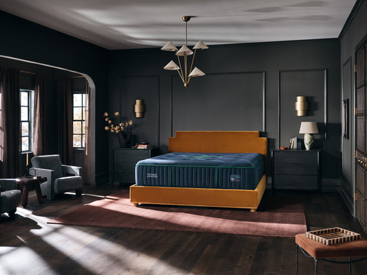 Stearns & Foster Reserve Medium Tight Top II mattress in a styled bedroom, three-quarter view