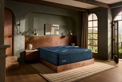 Stearns & Foster Reserve Medium Pillow Top II mattress in a styled bedroom, three-quarter view