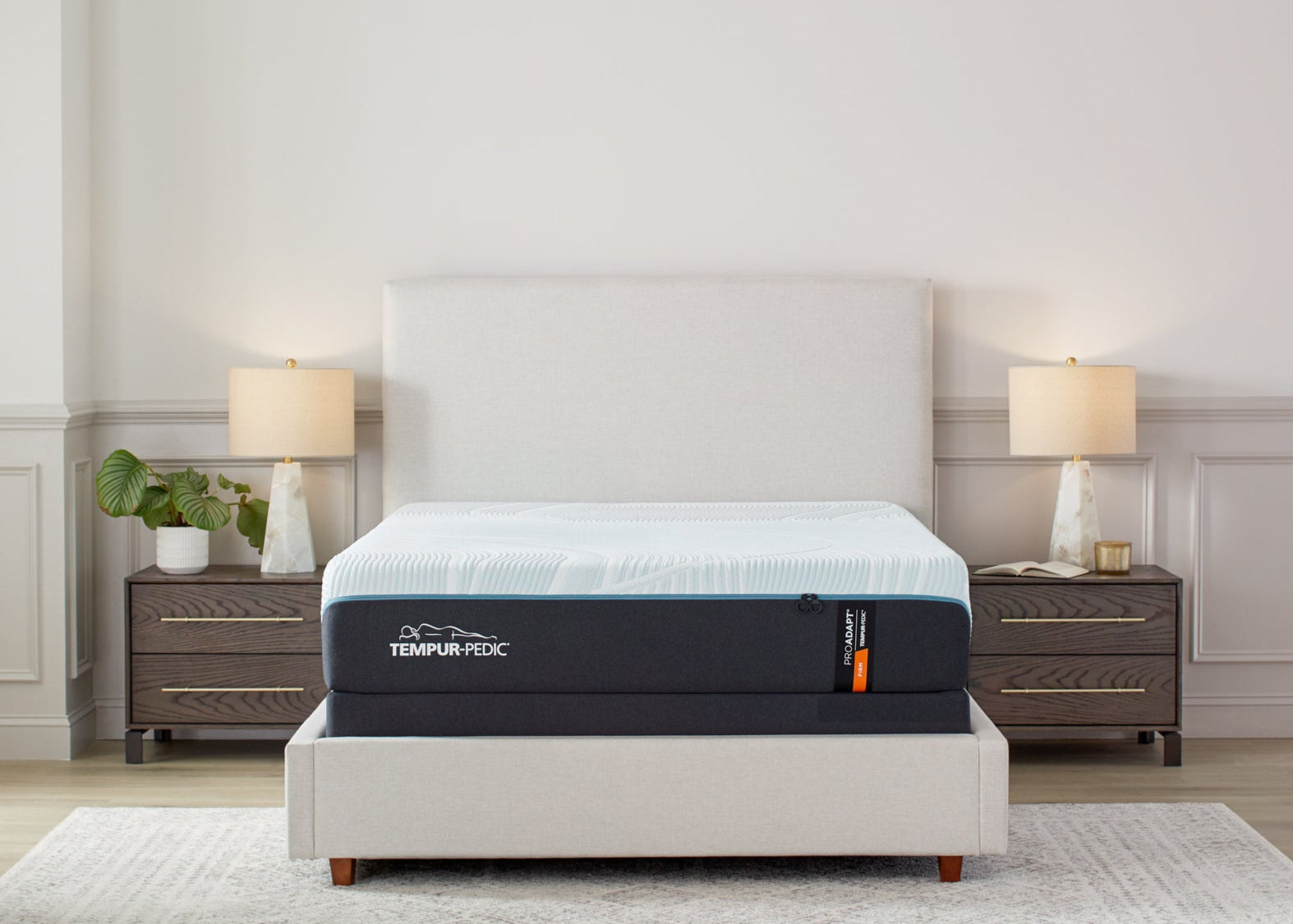Tempur-Pedic ProAdapt Firm Mattress for sale at Aventura Mattress, displayed in a bright modern bedroom with luxury neutral decor.